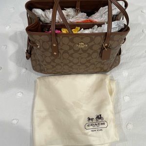 Coach shoulder bag, tan and brown color,